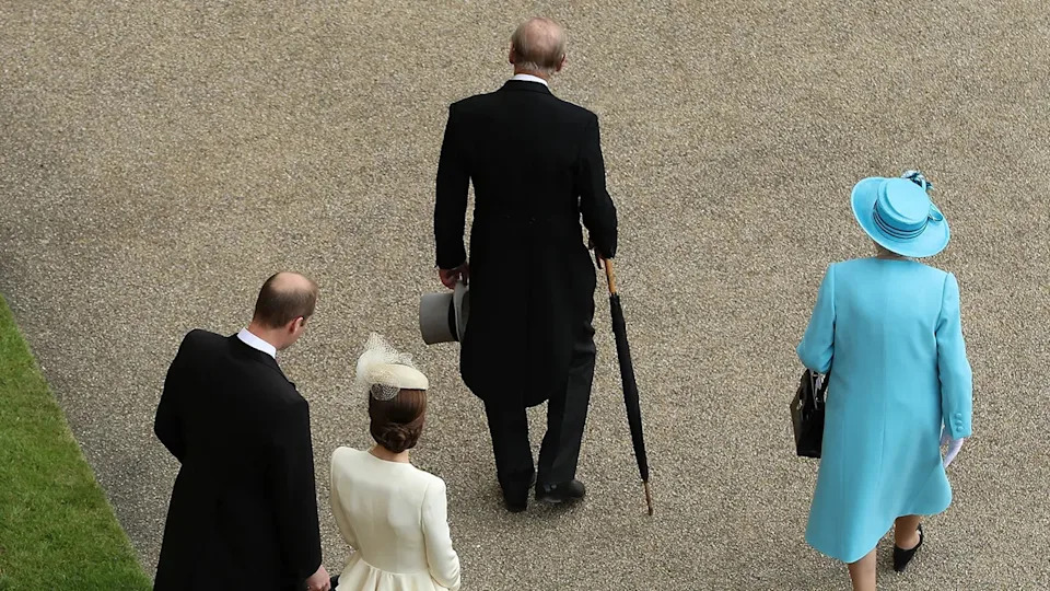 Queen Elizabeth and Prince Philip walking ahead of Kate Middleton and Prince William