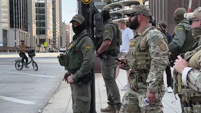 there's a video going viral online of 10 ICE agents vs. 1 food delivery driver
