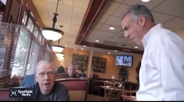 Republican candidate for Governor of New Jersey Jack Ciattarelli celebrates a voter telling him that he had already voted, before being told that he didn't vote for him