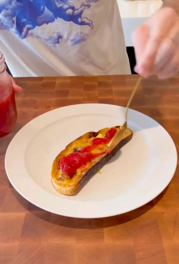 Brooklyn then placed the jam on a piece of bread. Brooklyn Peltz Beckham/Instagram