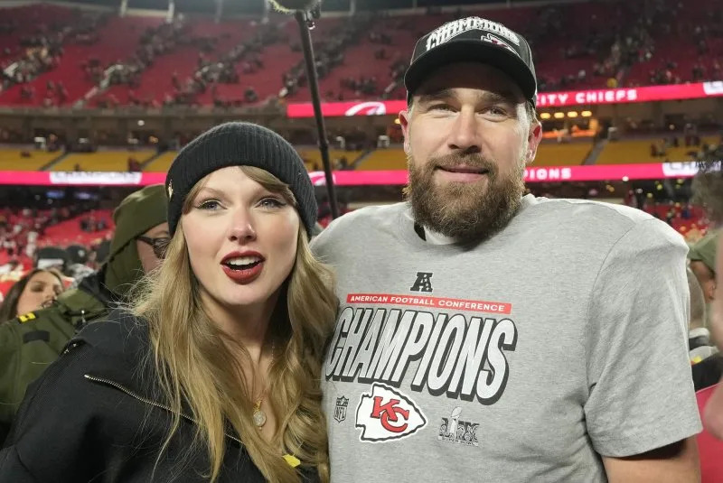 Kansas City Chiefs tight end Travis Kelce and his girlfriend entertainer Taylor Swift stand on the field after the Chiefs defeated the Buffalo Bills 32-29 in the AFC Championship Game in January. File Photo by Jon Robichaud/UPI.