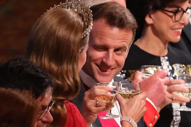 LUDOVIC MARIN/POOL/AFP via Getty France's President Emmanuel Macron winks at Kate Middleton at the state banquet on July 8, 2025