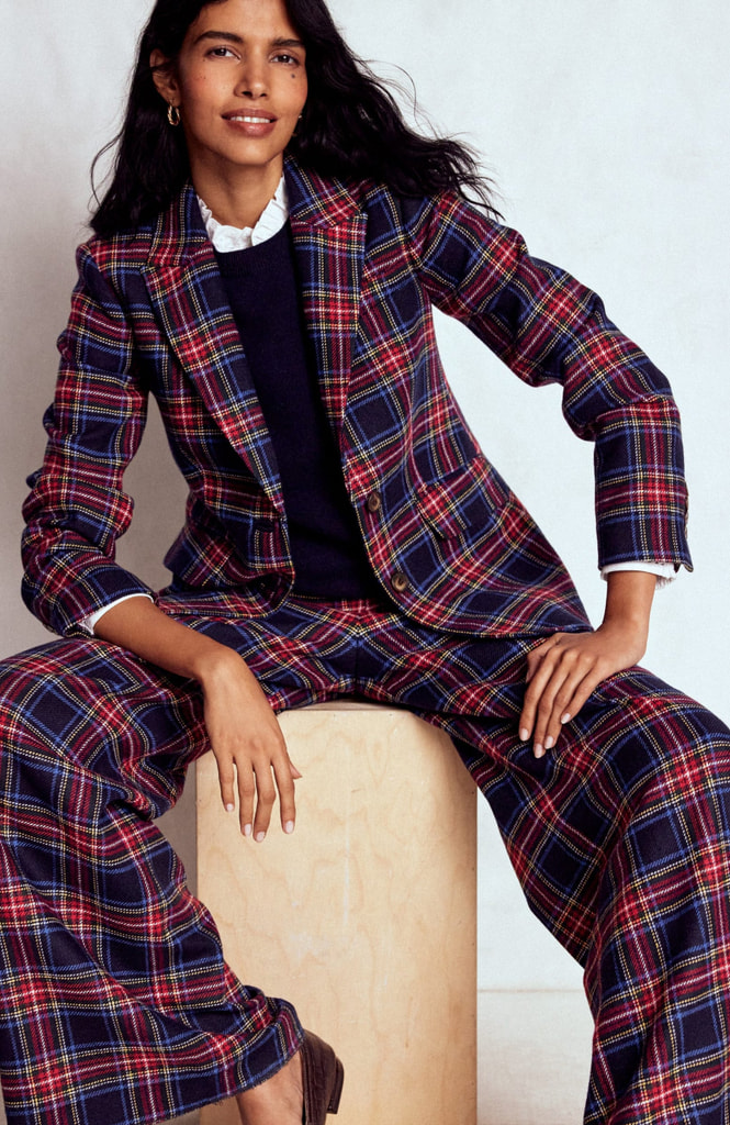 model in matching tartan blazer and trousers
