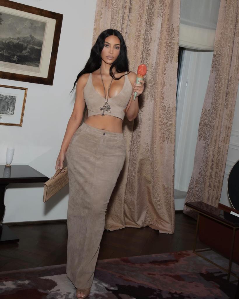 Kim Kardashian enjoys — or at least holds onto — a cone of fresh gelato while on a recent Italian getaway.






