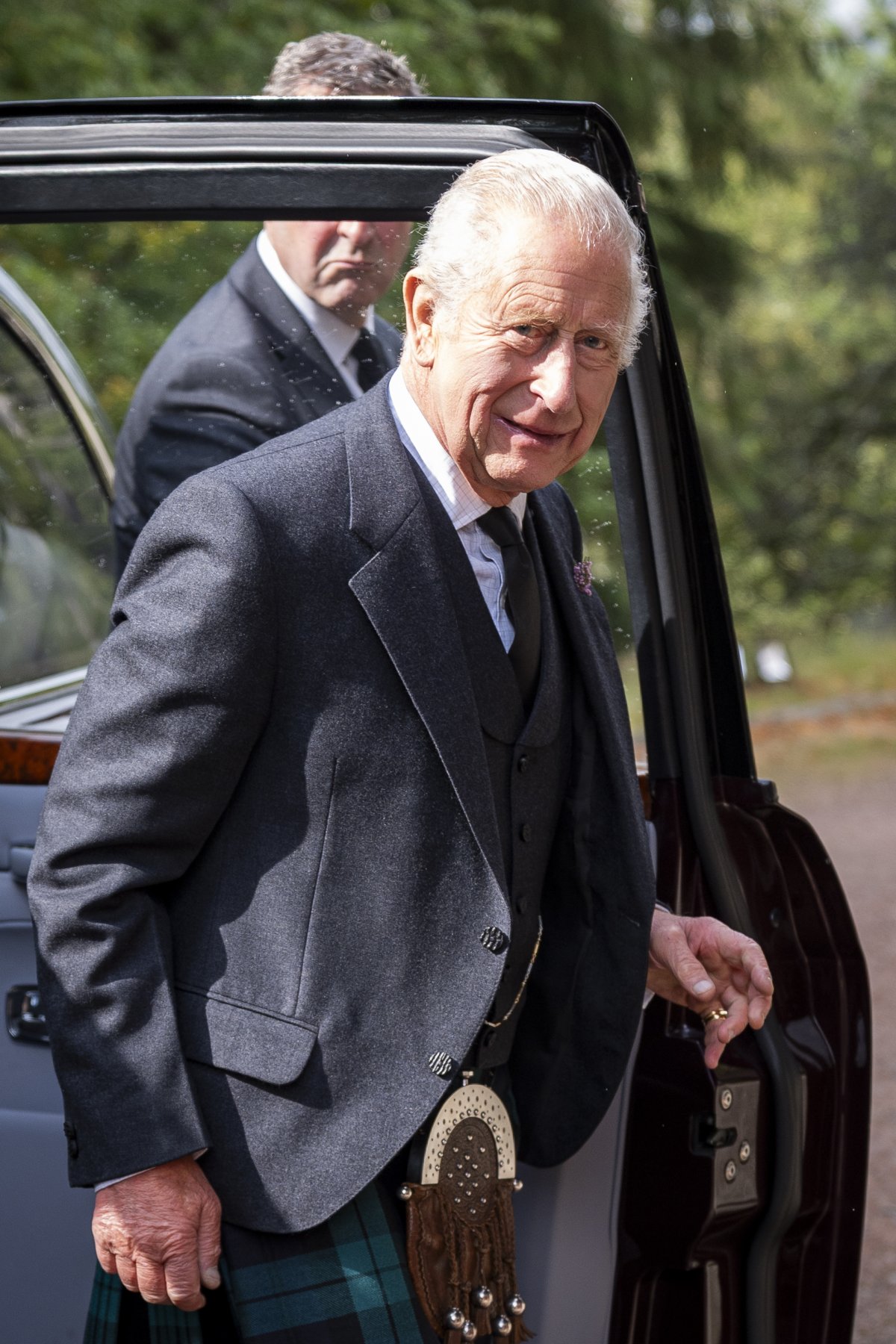 King Charles III looks at camera