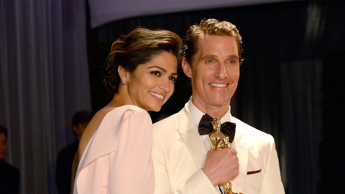 Matthew McConaughey wears white tux to Oscars with wife Camilla Alves