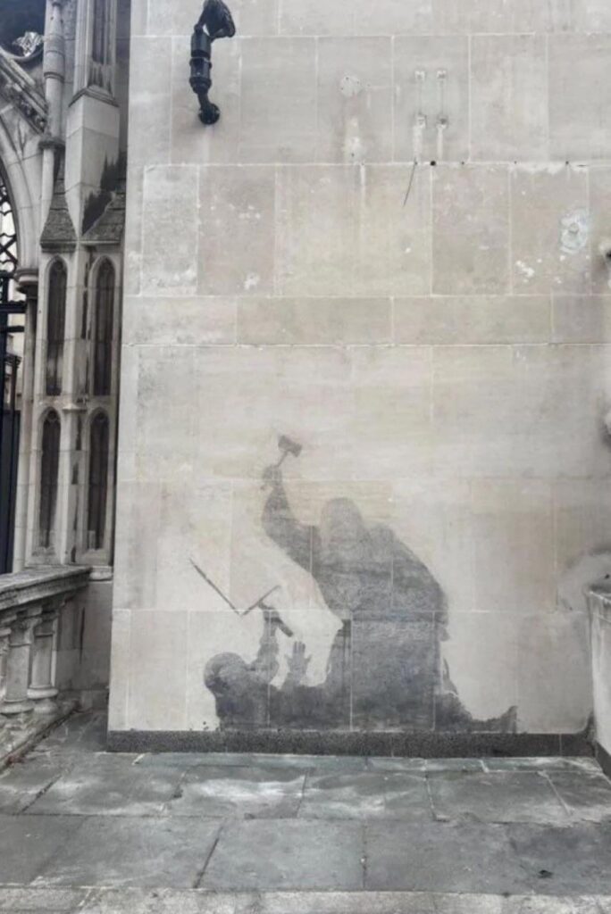The Banksy mural on the wall of a London court building depicting a protestor being attacked by a judge is being removed after just two days