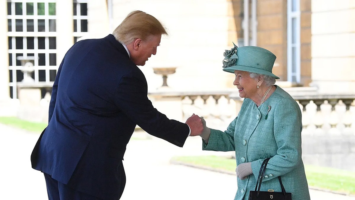 President Trump holding Queen Elizabeth's hand in the U.K.