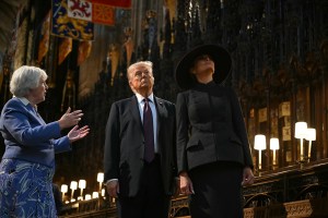 WINDSOR, ENGLAND - SEPTEMBER 17: US President Donald Trump (C) and US First Lady Melania Trump (R) tour the quire of St George's Chapel with Chapter Clerk Charlotte Manley (L) at Windsor Castle on September 17, 2025 in Windsor, England. (Photo by Andrew Caballero-Reynolds - WPA Pool/Getty Images)