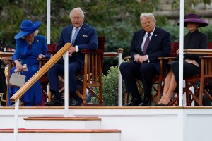 WINDSOR, ENGLAND - SEPTEMBER 17: U.S. President Donald Trump and First Lady Melania Trump attend a Beating Retreat ceremony with King Charles III and Queen Camilla on the east lawn of Windsor Castle during a state visit on September 17, 2025.  President Trump is in England from Sept. 16-18 on his second UK state visit, with the previous one taking place in 2019 during his first presidential term. (Photo by Anna Moneymaker/Getty Images)