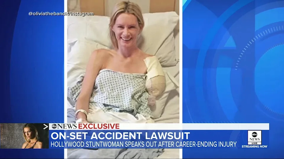 Smiling woman in a hospital bed with a bandaged arm. News banner below discusses a Hollywood stuntwoman's lawsuit after an on-set accident