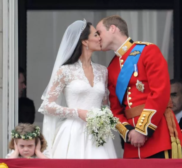 Catherine, Duchess of Cambridge and Prince William, Duke of Cambridge kiss on the balcony at Buckingham Palace on April 29, 2011 in London, England. 