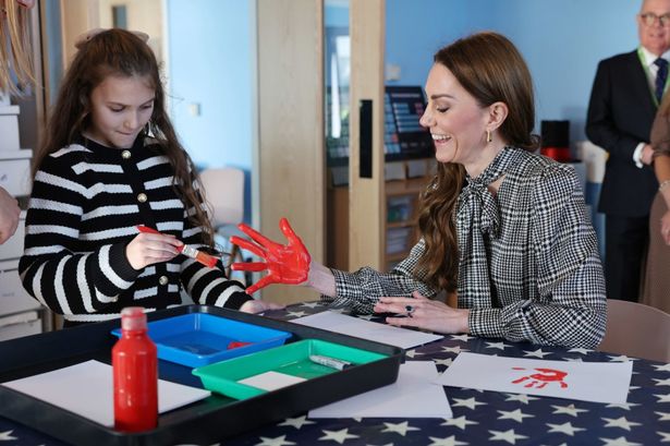 The Princess of Wales, Patron of Ty Hafan Children's Hospice, has her hand painted by nine-year-old Lottie 