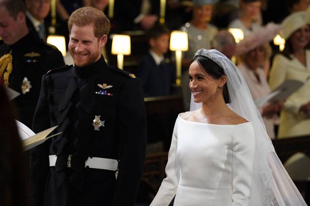 Prince Harry and Meghan Markle stand at the altar