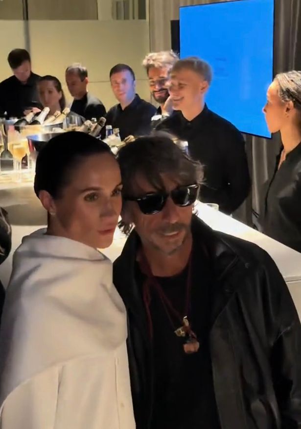 Meghan Markle with Italian fashion designer Pier Paolo Piccioli at Paris Fashion Week