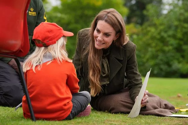 Kate talks to one youngsters about their artwork