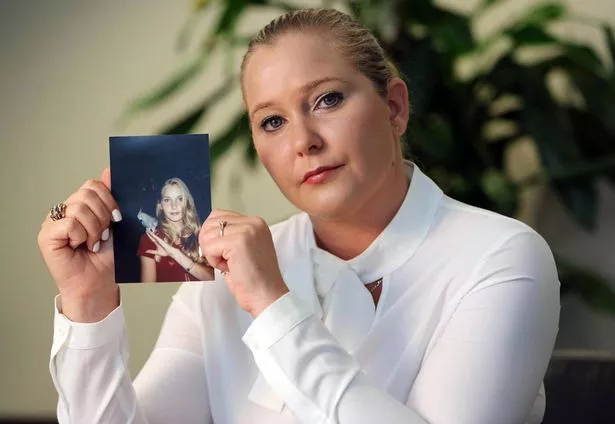 Virginia Giuffre, with a photo of herself as a teen, when she says she was abused by Jeffrey Epstein, Ghislaine Maxwell and Prince Andrew, among others