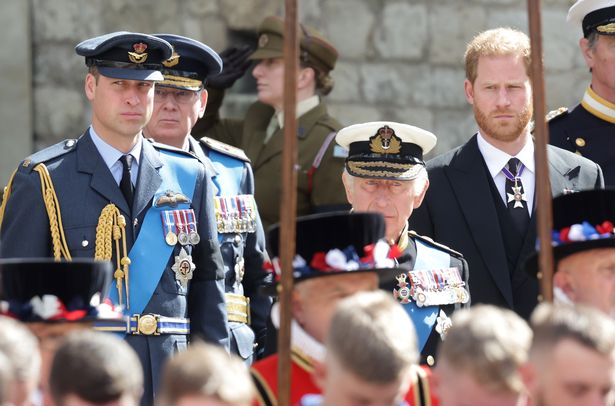 Prince William, Prince of Wales, King Charles III and Prince Harry, Duke of Sussex watch the coffin of HM Queen Elizabeth during The State Funeral Of Queen Elizabeth II at Westminster Abbey on September 19, 2022