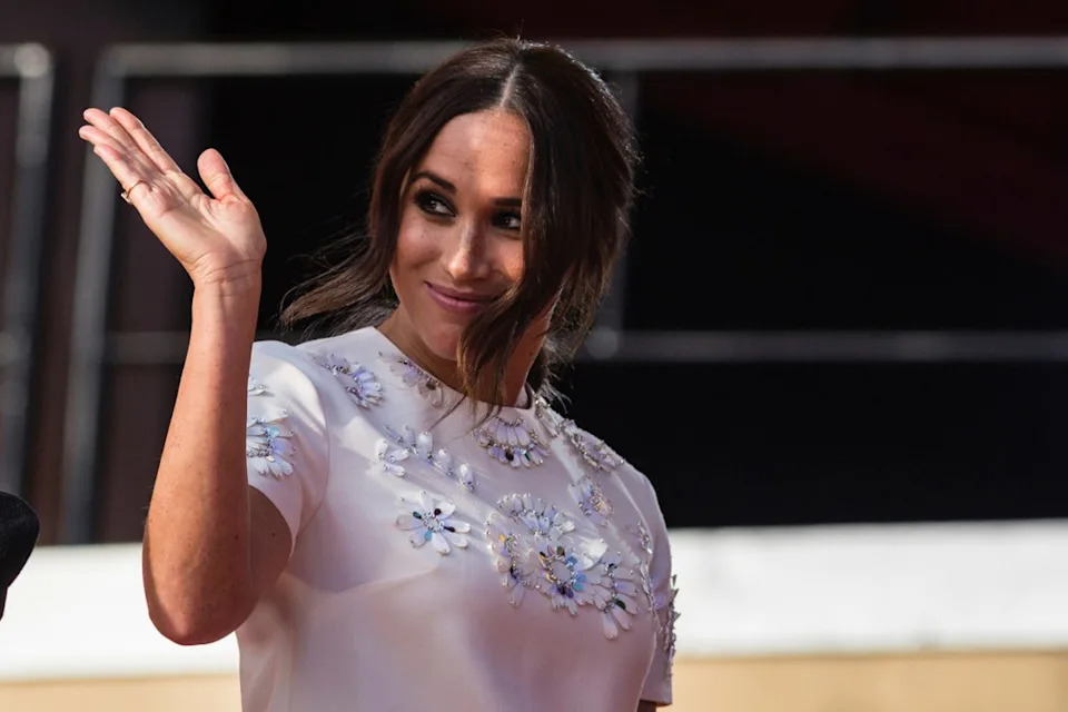 FILE – Meghan Markle, Duchess of Sussex, salutes during the Global Citizen festival, on Sept. 25, 2021 in New York. A British newspaper publisher began Tuesday its court appeal against a judge’s ruling that it invaded the privacy of the Duchess of Sussex by publishing parts of a letter she wrote to her estranged father, arguing that she knew the letter would potentially be published. (AP Photo/Stefan Jeremiah)
