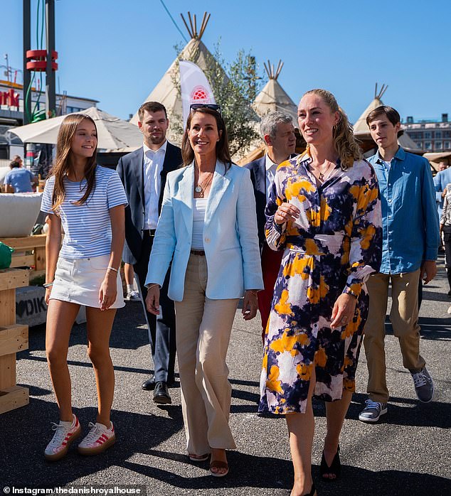 During a return visit to Copenhagen in August, Princess Marie (centre), along with her teenage children Countess Athena (far left) and Count Henrik (far right), attended a food festival