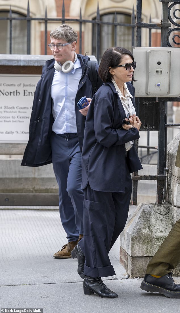 Graham Johnson, a member of the legal research team helping Prince Harry and others, leaving the High Court with actress Sadie Frost