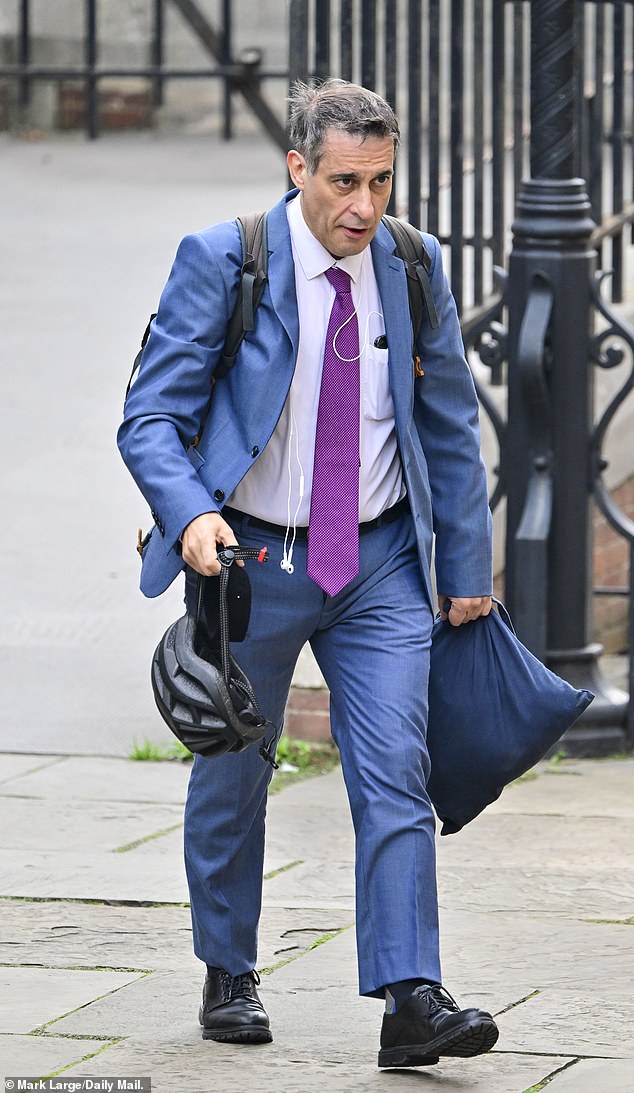 Dr Evan Harris, a former Lib Dem MP and now a member of the legal research team, arriving at the High Court which heard claims he had been involved in a 'scheme' to mislead the court