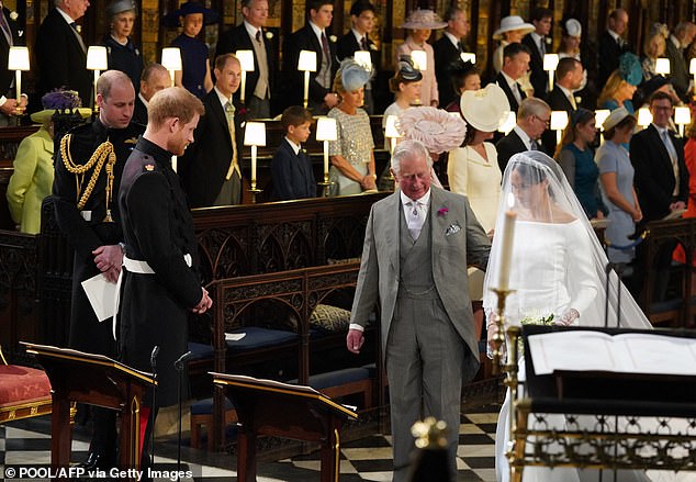 Queen Camilla, who had previously been married to Andrew Parker Bowles between 1973 and 1995, stuck with tradition and opted not to wear white for her wedding to Charles in 2005. Pictured: Charles walking Meghan down the aisle