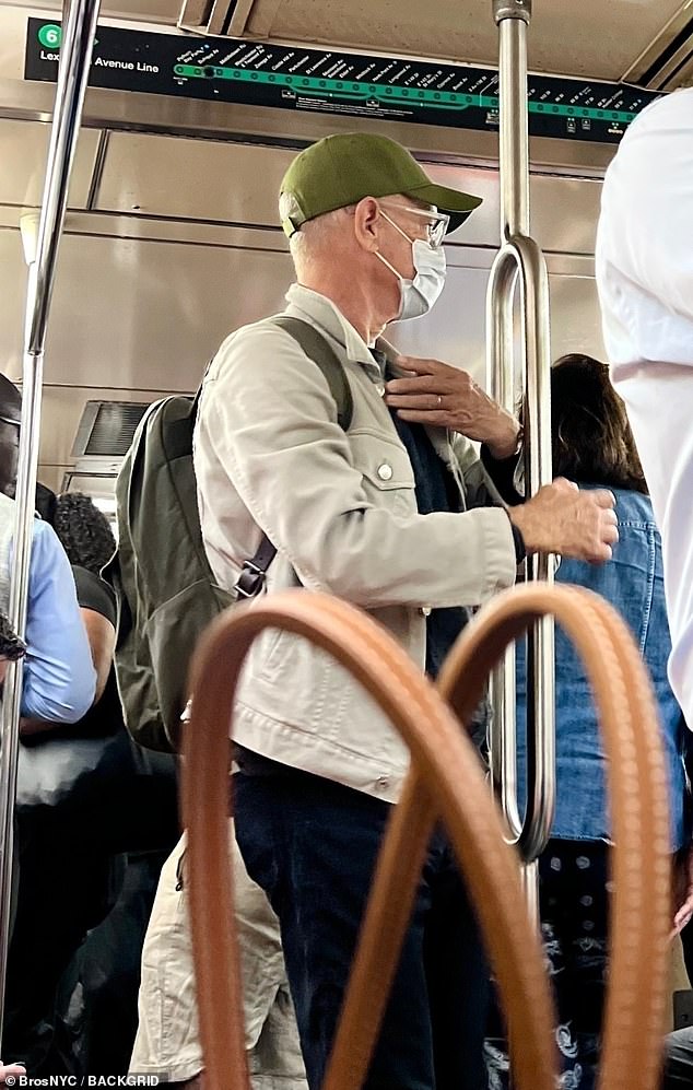 Hanks appeared perfectly at ease during the commute, standing near the doors and glancing around the crowded carriage like any other passenger