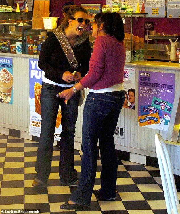 Spears is seen at a Ben and Jerry's parlor in Malibu in 2004 laughing with a friend