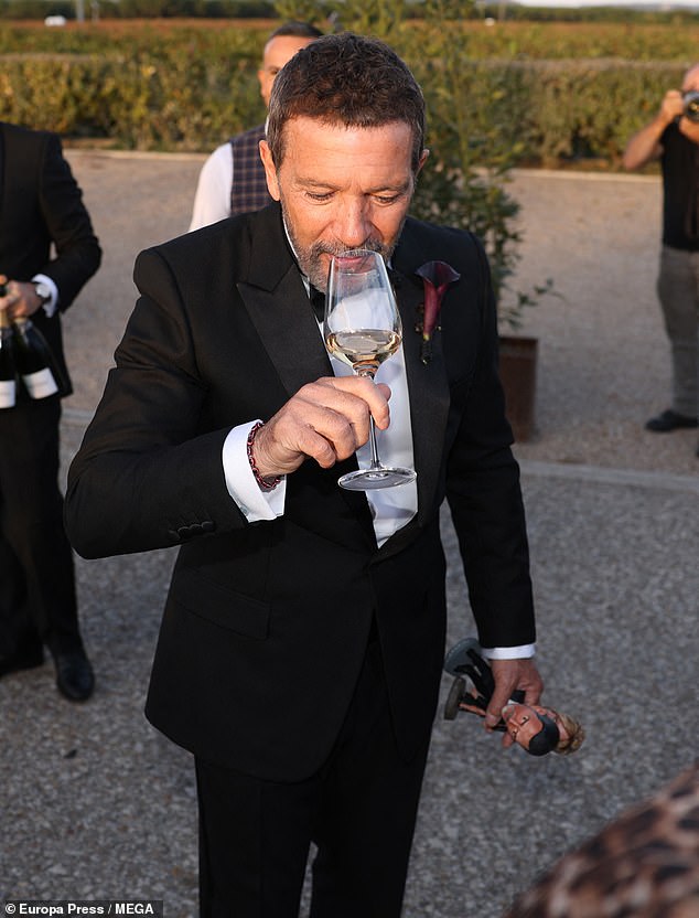 Glasses of wine were poured from bottles and passed around to others outside amid the festivities