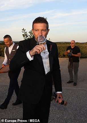 At one point, he could be seen holding up a glass of wine as he proudly celebrated his daughter's special milestone