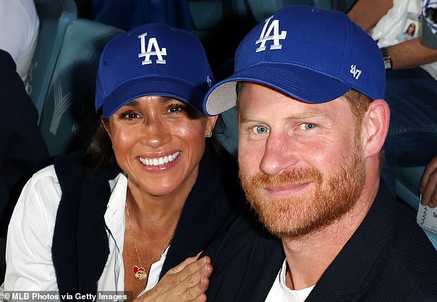 Meghan Markle, left, glimmered from the bleachers last night as she enjoyed an atmospheric evening watching the LA Dodgers baseball game with Prince Harry, right, just hours after launching a festive collection for her lifestyle brand