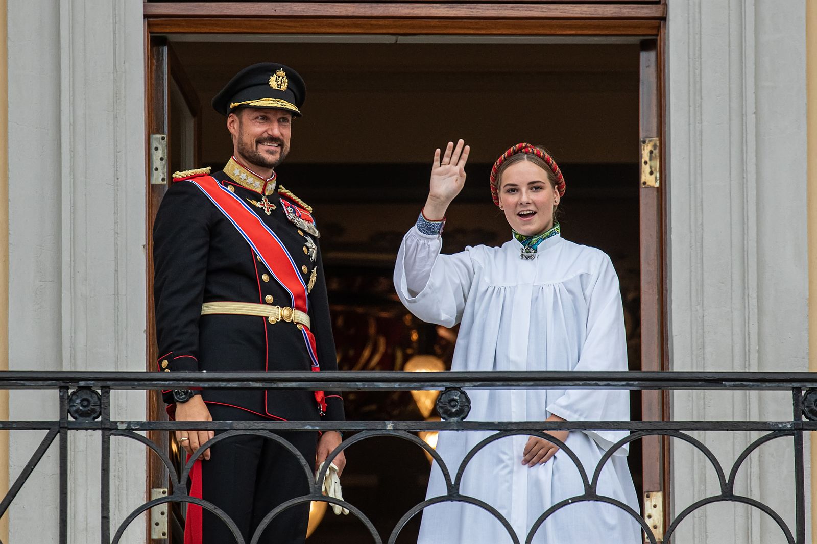Crown Prince Haakon and Princess Ingrid Alexandra wave to crowds as they attend her confirmation service in 2019
