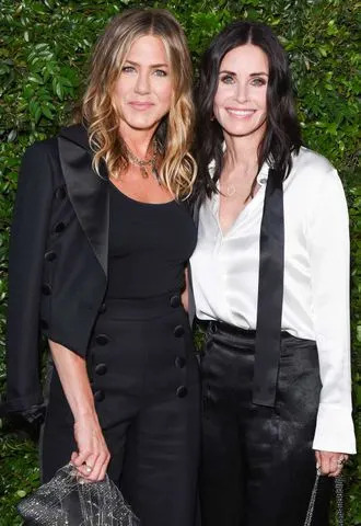 Presley Ann/Patrick McMullan via Getty Jennifer Aniston and Courteney Cox.