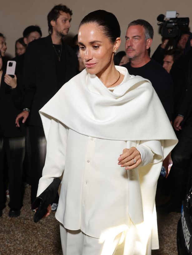 Meghan during her dramatic appearance at the Balenciaga runway show 