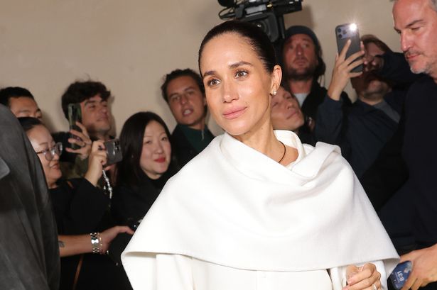 Meghan Markle pictured at the Balenciaga show during Paris Fashion Week