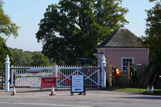 Workmen erecting additional fencing at Cranborne Gate