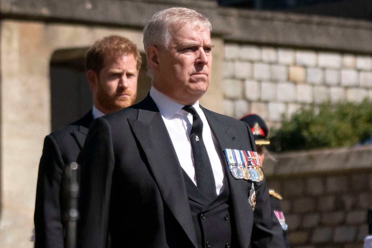 Stern looking man in dark suit