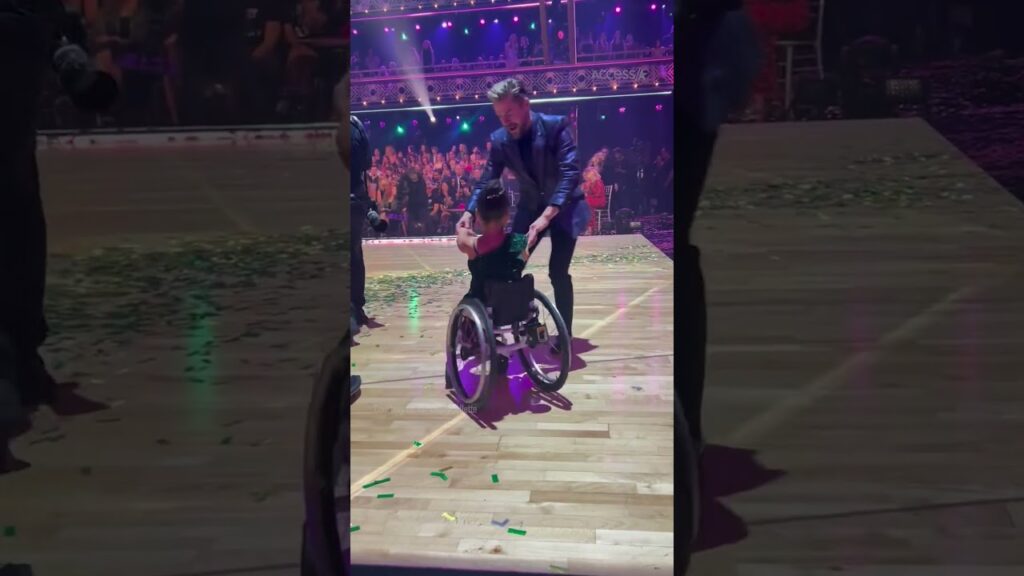 ‘Wicked’s “Baby Nessarose” Adorably Has ‘First Ballroom Lesson’ With DWTS’ Derek Hough