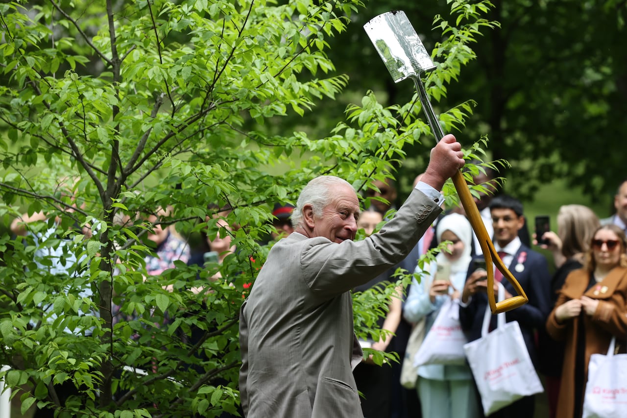 King Charles and Queen Camilla plant a Blue-Beech, a small deciduous tree native to eastern North America, during a tree planting ceremony at Rideau Hall, in Ottawa on May 26, 2025.  