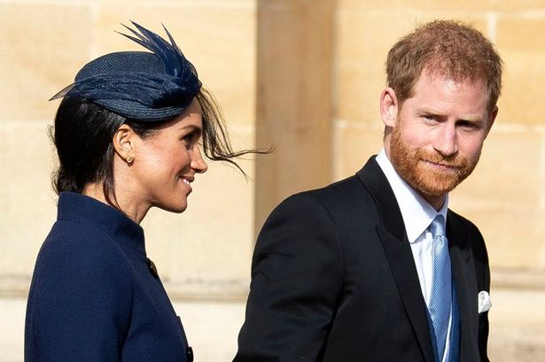 Britain's Prince Harry, Duke of Sussex (R) and Meghan, Duchess of Sussex (L) leave after the royal wedding ceremony of Princess Eugenie of York and Jack Brooksbank
