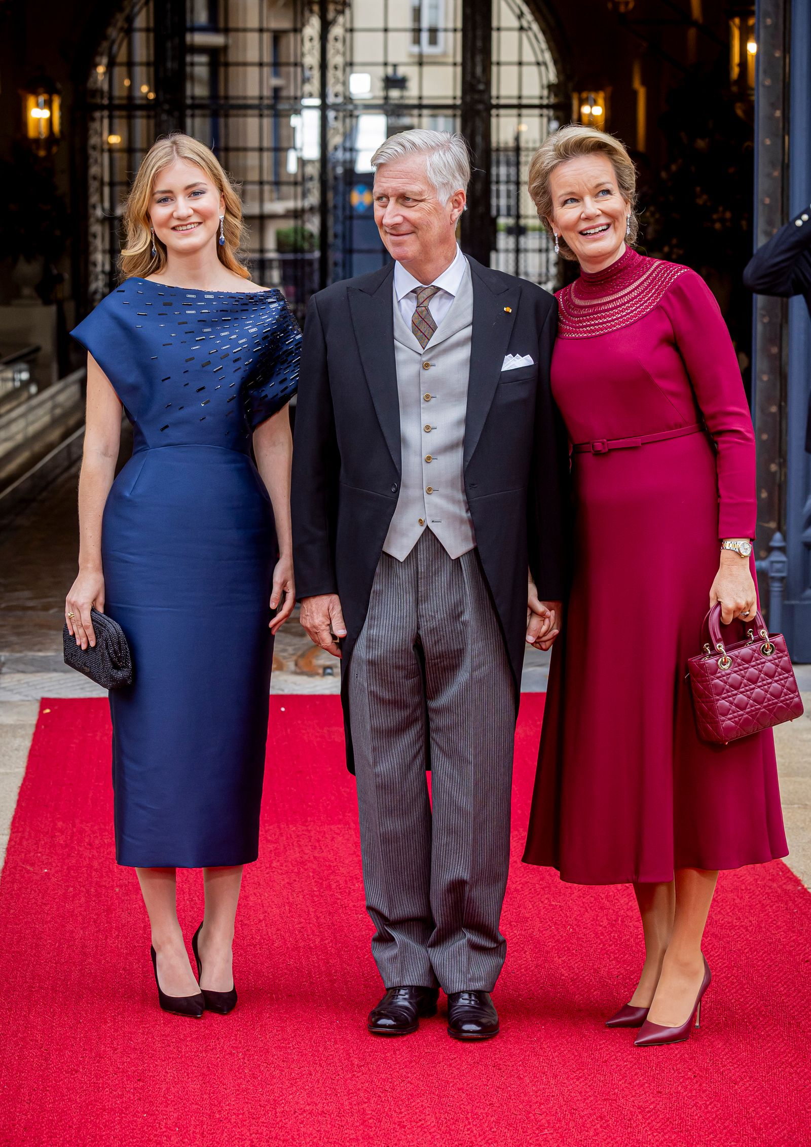 Queen Mathilde of Belgium pictured with husband King Philippe and daughter Princess Elisabeth looked elegant in...