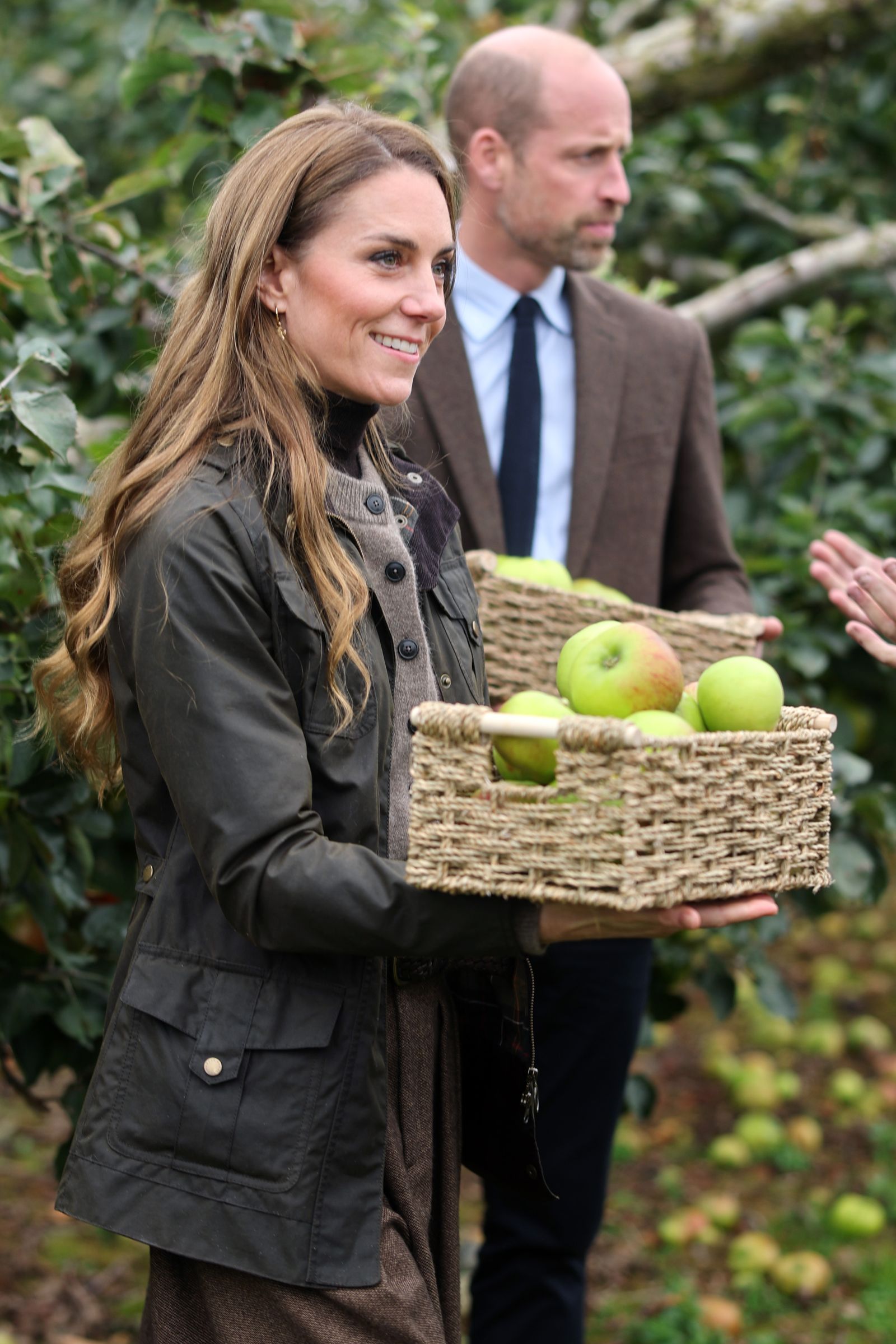 Kate and William pick apples during their visit to Long Meadow Cider.