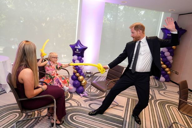 The Duke of Sussex play fights using swords made from modelling balloons with nine-year-old Gwen Foster, recipient of Inspirational Child 7-11 award, at the annual WellChild Awards 2025
