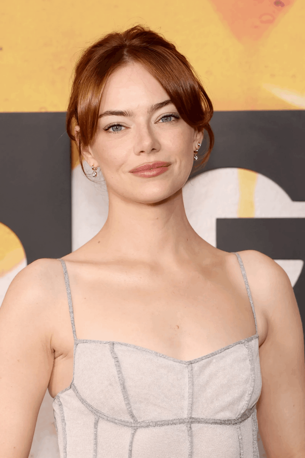 Emma Stone in custom Louis Vuitton and in the next phase of her pixie cut, at the New York screening of her new film Bugonia