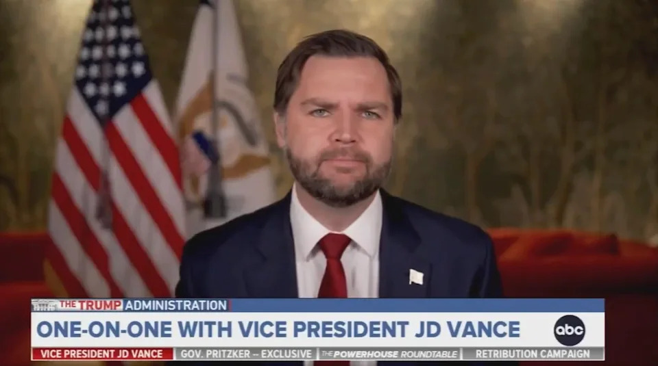 A person in a suit appears on a television screen with American flags in the background. Text below mentions "ONE-ON-ONE WITH VICE PRESIDENT JD VANCE."