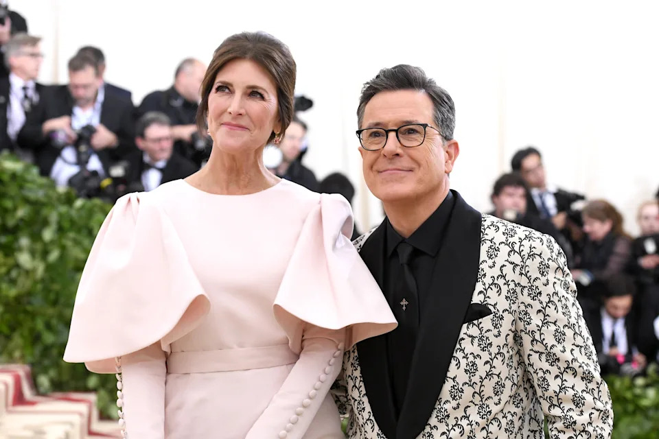 Evelyn McGee-Colbert in a gown with puffy sleeves and Stephen Colbert in a patterned tuxedo jacket at the Met Gala
