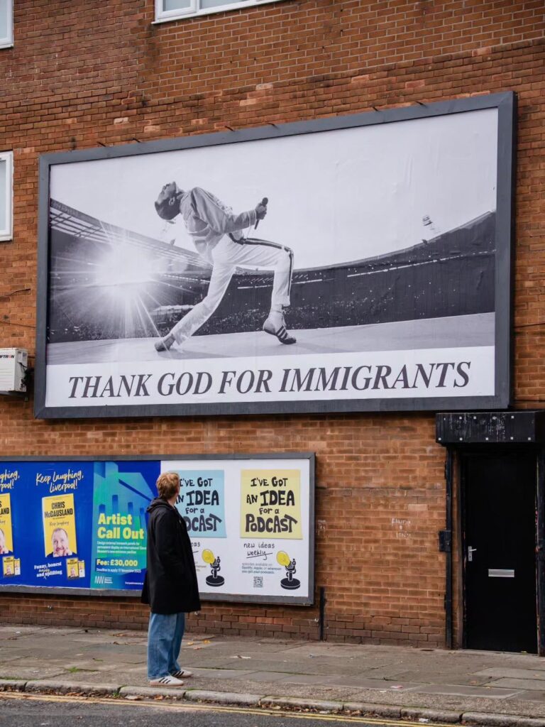 UK political campaign group ‘Everyone Hates Elon’ have unveiled a new billboard in Liverpool featuring Freddie Mercury, marked with the caption ‘Thank God for Immigrants’: “Billionaires want you to hate immigrants, so we don’t blame them for our problems. We won’t fall for it.” UK political campaign group ‘Everyone Hates Elon’ have unveiled a new billboard in Liverpool featuring Freddie Mercury, marked with the caption ‘Thank God for Immigrants’: “Billionaires want you to hate immigrants, so we don’t blame them for our problems. We won’t fall for it.”