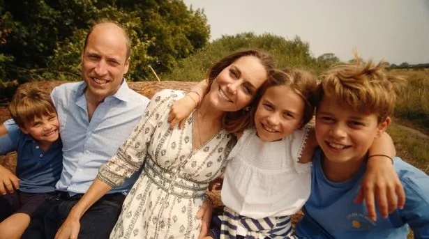William and Kate cuddle up to George, Charlotte and Louis 