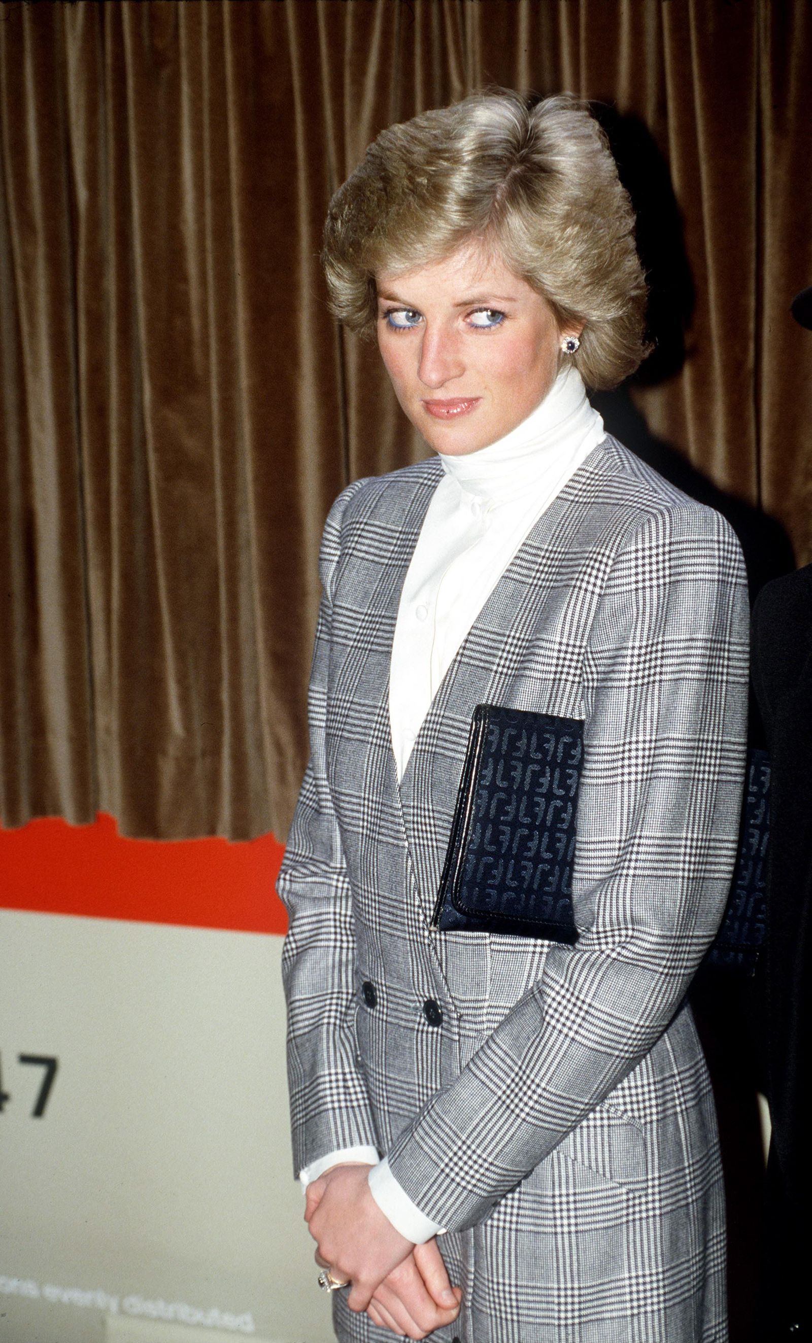 Princess Diana wore a Prince of Wales check suit by Catherine Walker on a trip to Paddington in 1988